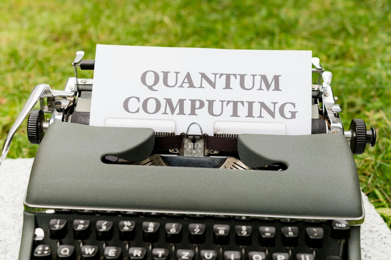 A typewriter with a paper that says quantum computing